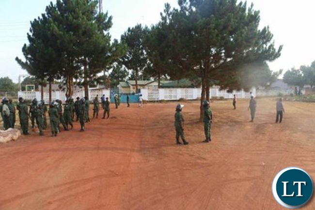 Police officers outside Radio Mano