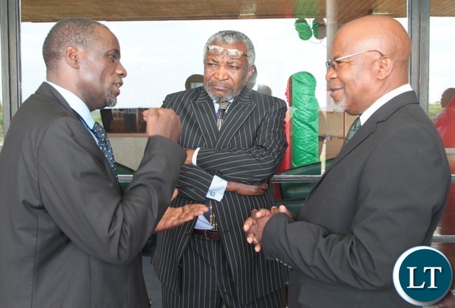 Former Finance Minister ,Katele Kalumba(left) confers with Mangande Mwanajiti before the presentation of 2017 budget in Lusaka.Looking on is Patrick Kalifungwa. Former Finance Minister ,Katele Kalumba(left) confers with Mangande Mwanajiti before the presentation of 2017 budget in Lusaka.Looking on is Patrick Kalifungwa.