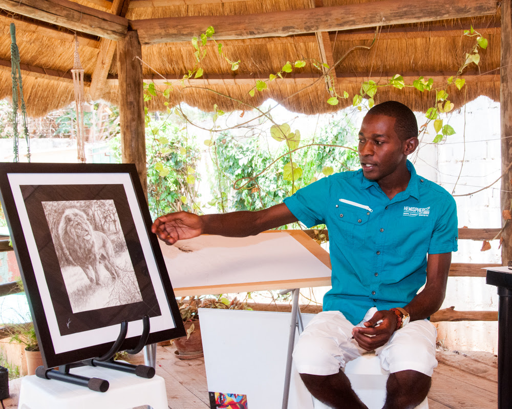 Talented 23-year-old artist Silvester Mali at work on his drawings.