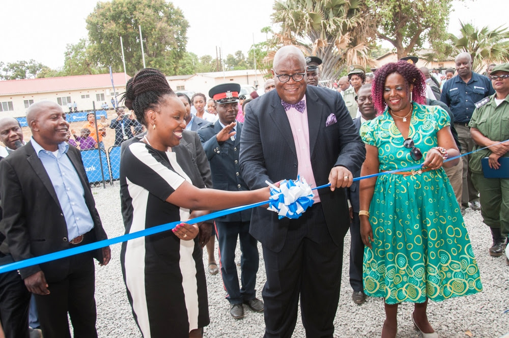Stanbic Bank chief executive Mukwandi Chibesakunda and Mazabuka Provincial permanent secretary Sibaze Simuchoba commission the new mothers' shelter at Mazabuka General Hospital.
