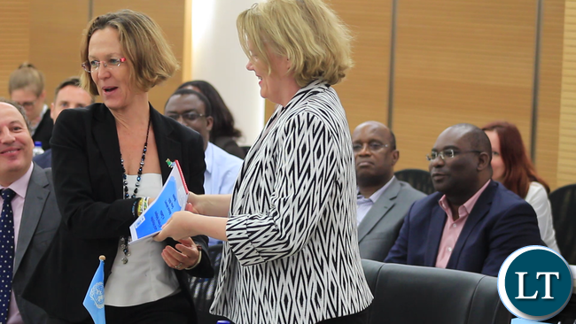 UNHCR Representative, Ms Laura Lo Castro, hands-over the Local Integration National Advisory Group Co-chair role to the UNDP Resident Representative, who is also UN Resident Co-ordnator in Zambia, Ms Janet Rogan