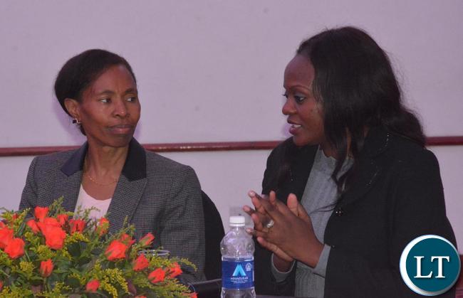 Ministry of Commerce,Trade and Industry Agriculture Director Planning Mwila Daka(r) confers with the Permanent Secretary Kayula Siame(l) during the Consultative Meeting on the Border Management(Trade Facilitation) Bill,2017