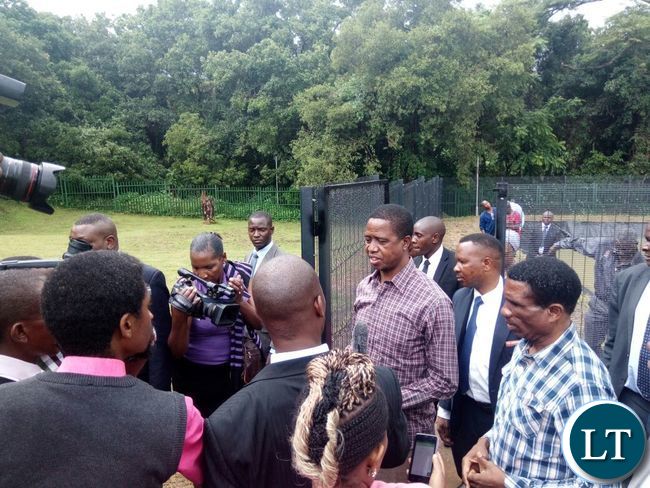 President Edgar Lungu with Livestock and fisheries Minister Michael Katambo inspects some fish ponds during the restocking of fingerlings at the State Lodge Ponds