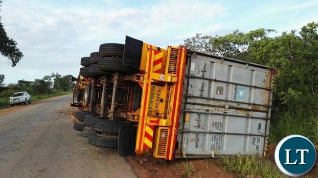 Tanzanian truck registration number T445CWU yesterday lost control and overturned along the Isoka-Chinsali road after hitting into the pothole.Pictures By Evans Kazonga Ngoma Tanzanian truck registration number T445CWU yesterday lost control and overturned along the Isoka-Chinsali road after hitting into the pothole.Pictures By Evans Kazonga Ngoma