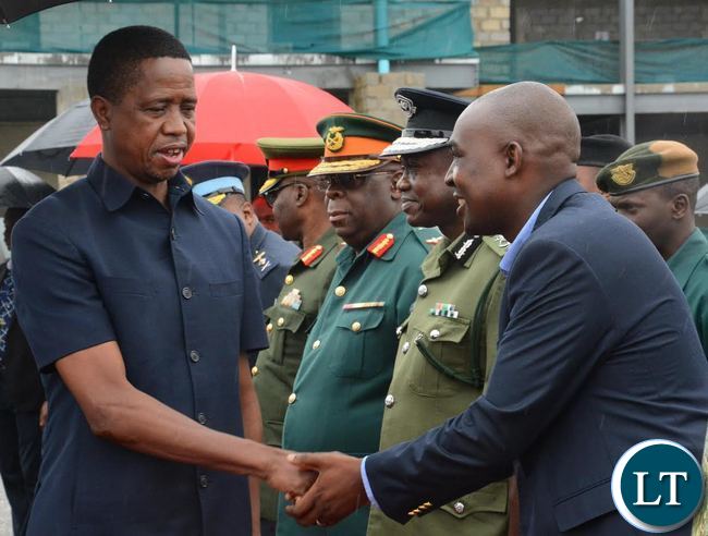 President Edgar Lungu(l) greets Lusaka Province Minister Japhen Mwakalombe(r) before departure for Chipata at City Airport President Edgar Lungu(l) greets Lusaka Province Minister Japhen Mwakalombe(r) before departure for Chipata at City Airport