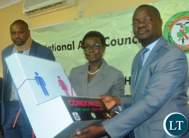 United Nation Fund for Population Actives (UNFPA)Country Director Mary Otieno handover Condom Dispensers to National Aids Council Acting Director John Mwale at National Aids Council offices United Nation Fund for Population Actives (UNFPA)Country Director Mary Otieno handover Condom Dispensers to National Aids Council Acting Director John Mwale at National Aids Council offices