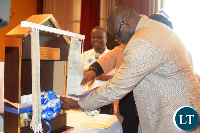 Ministry of Health Permanent Secretary Dr. Jabbin Mulwanda cuts the ribbon to officially launch the 2016-2020 Strategic Plan, This was during the official launch of the General Nursing Council Strategic Plan yesterday at Golden Peacock Hotel in Lusaka. Ministry of Health Permanent Secretary Dr. Jabbin Mulwanda cuts the ribbon to officially launch the 2016-2020 Strategic Plan, This was during the official launch of the General Nursing Council Strategic Plan yesterday at Golden Peacock Hotel in Lusaka.