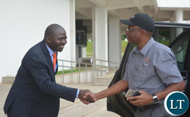 Minister of Energy Mathew Nkhuwa(r) being welcomed by Ministry of Housing and Infrastructure Development Structural Engineer Francis Mundanya(l) at Heroes Stadium