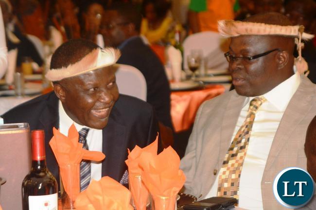 Finance Minister Felix Mutati(l) confers with Chief Madzimawe(r) during the Ngoni Cultural Night and Dinner Dance at New Government Complex