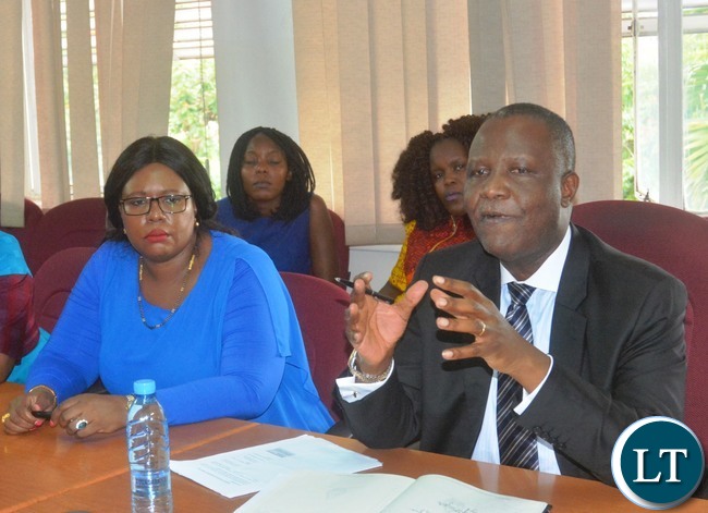 Minister of Finance Felix Mutati(r) stresses out a point while Agriculture Minister Dora Siliya(l) listens attentively during a Press Briefing at the Ministry of Finance