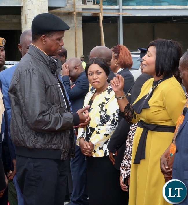 Minister of Information Kampamba Mulenga speaking to President Edgar Lungu at city airport shortly before the Presidents departure for North Western Province