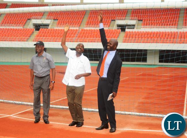 Minister of Works and Supply Mathew Nkhuwa(second right),Lusaka Province Minister Japhen Mwakalombe(second left), Ministry of Housing and Infrastructure Development Structural Engineer Francis Mundanya(l) and Ministry of Sports and Youths Chief Sports Development Officer Gibson Muyaule(l) during the tour of Infrastructure at Heroes Stadium
