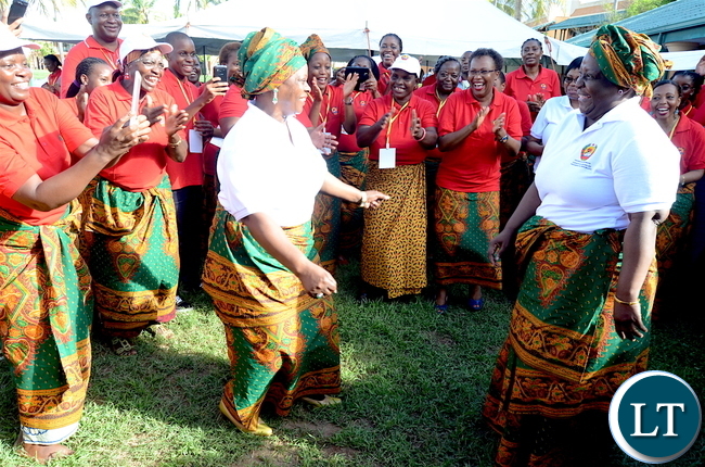 First Lady Esther Lungu and Mozambique First Lady  Isaura Nyusi join women in dancing  during the closing ceremony of the just ended Conference on ending child marriage and early pregnancies in Pemba City, Mozambique on  Sunday,February 26,2017 -Picture by THOMAS NSAMA/STATE 