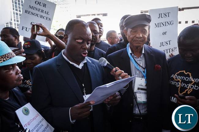 Father Aidan Msafiri of Tanzania Episcopal Conference reads the Alternative Mining Indaba's final declaration.