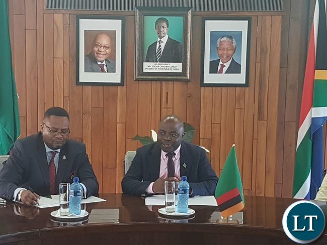 Home Affairs Stephen Kampyongo with High Commissioner Emmanuel Mwamba