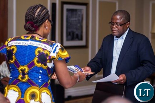 Rev Matale presenting the declaration to Mines Minister Chris Yaluma