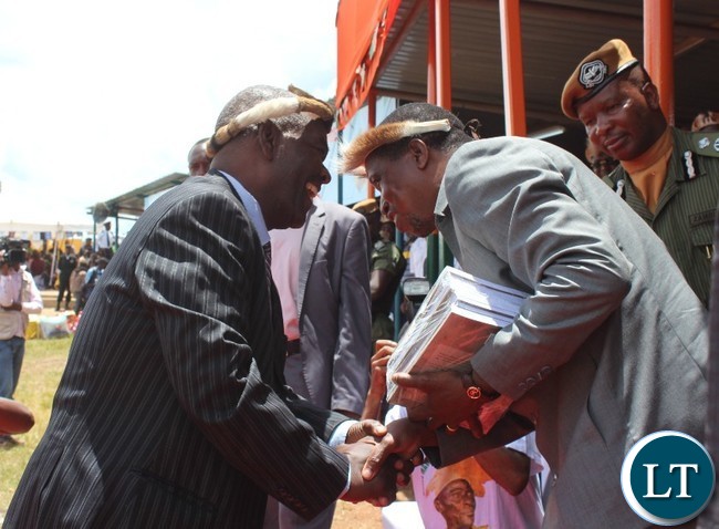PROFESSOR Yizenge Chondoka talks to President Edgar Lungu after he presented books entitled ‘ The Zwangendaba Mpezeni Ngoni ‘ which he authored. This was at this year’s Ncwala ceremony in Chipata. PICTURE BY STEPHEN MUKOBEKO/ZANIS