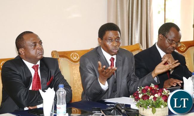 National House of Prayer Advisory Board Chairperson Bishop Joshua Banda speaking during press briefing whilst His Vice Chairperson Rev: Pukuta Mwanza (r) and Board Member David Nama (l) listens National House of Prayer Advisory Board Chairperson Bishop Joshua Banda speaking during press briefing whilst His Vice Chairperson Rev: Pukuta Mwanza (r) and Board Member David Nama (l) listens