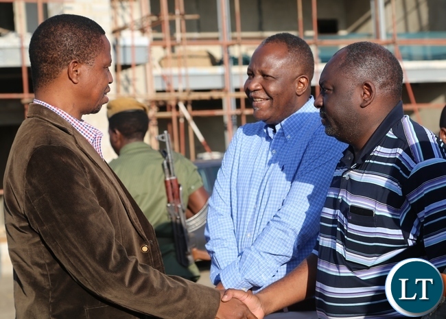 President Edgar Lungu shake hands with Minister of defence Davis Chama,while Minister of Finance Felix Mutati looks during his departure to Muchinga Province at City Airport in Lusaka President Edgar Lungu shake hands with Minister of defence Davis Chama,while Minister of Finance Felix Mutati looks during his departure to Muchinga Province at City Airport in Lusaka