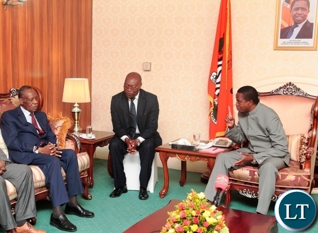 President Edgar Lungu speaks to CAF President Issa Hayatou at State House when he called on the President Lungu