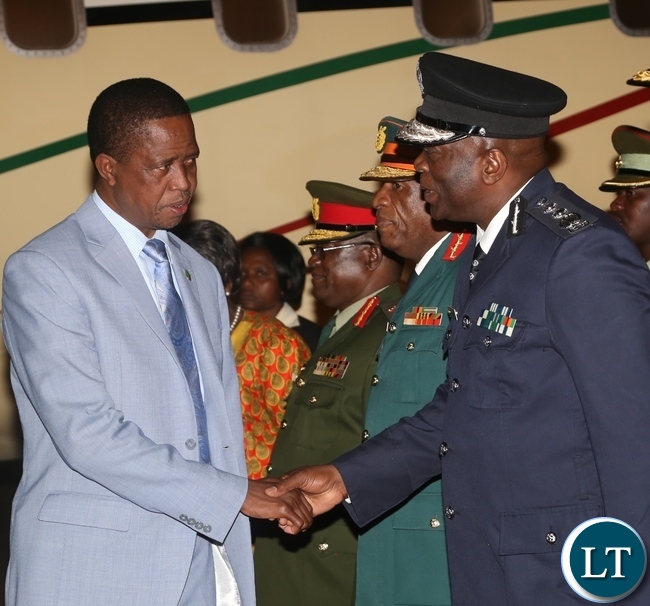 President Edgar Lungu(l) being welcomed by Inspector of Police Kakoma Kanganja(r) as he arrives from Israel last night around 19:04.Picture by Ennie Kishiki/Zanis.