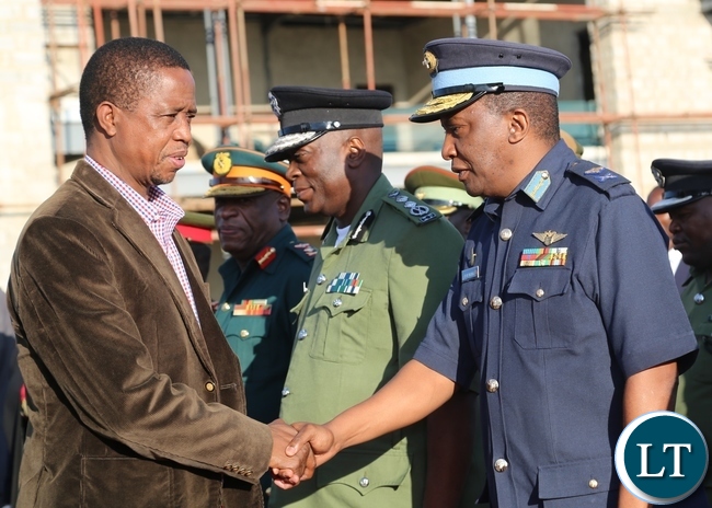 President Edgar Lungu shake hands with Zambia Air Force Major General Deputy Commander David Muma during his departure to Muchinga Province at City Airport in Lusaka