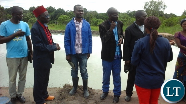 Senior Chief Mwamba of the Bemba people with his subjects