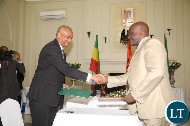 Vice President of the Zambia Chamber of Commerce and Industry Andrew Sinyangwe with Ethiopian Counterpart President of the Addis Ababa Chamber of Commerce and Sectoral Associations Elias Geneti signs the Memorandum of Understanding between chamber of commerce and industry and Addis Ababa Chamber of Commerce and Sectoral Associations at state House