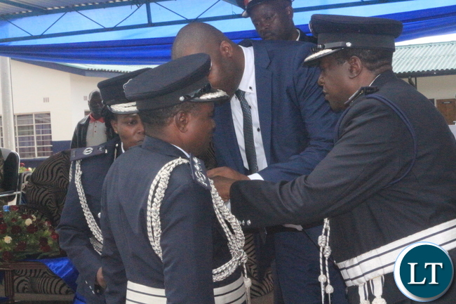 Copperbelt Minister, Bowman Lusambo unveiling medals given to deserving Police Officers during 'Police Day' at Kamfinsa School of Meintenance in Kitwe