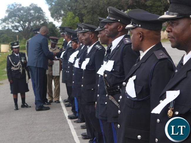 Copperbelt Minister, Bowman Lusambo unveiling medals given to deserving Police Officers during 'Police Day' at Kamfinsa School of Meintenance in Kitwe