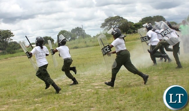 IN RIOT GEAR: Police women in Serenje district demonstrate how Police quail riots. This was during the commemoration of the International women’s day in Serenje district held at the national square.