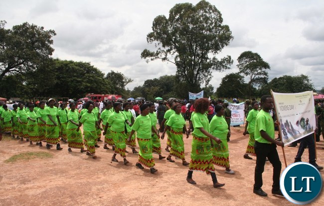 Women from Kansanshi mine marching during the commemoration of International Women Day at Youth Grounds in Solwezi on Wednesday. PICTURE BY BETRAM KAOMA /ZANIS