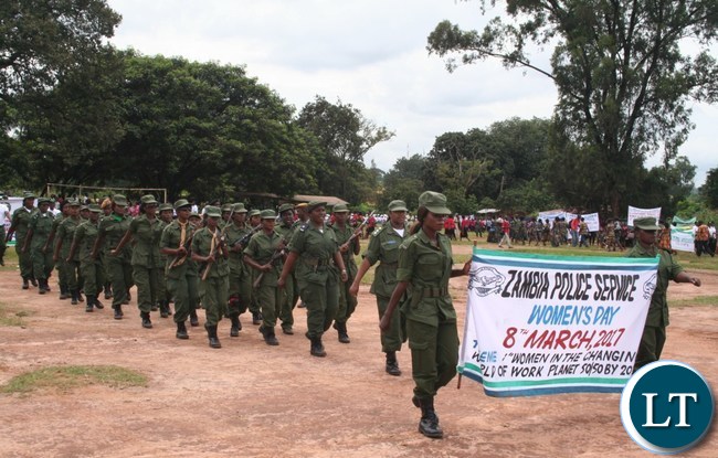 Women from Zambia Police service marching during the commemoration of International Women Day at Youth Grounds in Solwezi on Wednesday. PICTURE BY BETRAM KAOMA /ZANIS