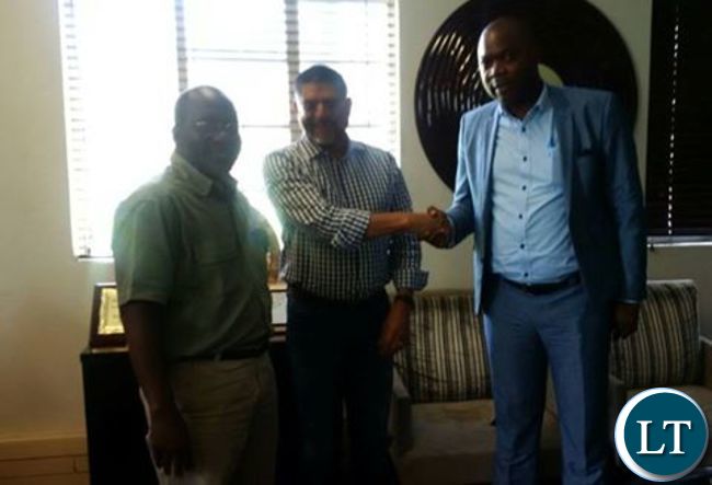 KCM CEO Stevin Din shakes hands with Copperbelt Minister Bowman Lusambo after donating 20,000 AFCON match ticekts KCM CEO Stevin Din shakes hands with Copperbelt Minister Bowman Lusambo after donating 20,000 AFCON match ticekts