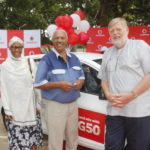 (L-R) Winner of the KIA Picanto Mr Berhane Kibrom poses alongside Vodafone CEO Lars Stork.