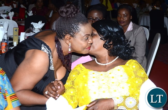First Lady Esther Lungu being hugged by former first Lady Maureen Mwanawasa during the Afro Multi Media Productions Women of the Year Awards giving Ceremony to mark the International Women's Day Celebrations at Government Complex in Lusaka on Tuesday, March 7,2017 -Picture by THOMAS NSAMA