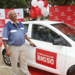Mr Berhane Kibrom, winner of the grand prize in Vodafone’s BIG 50 promotion next to his brand new KIA Picanto