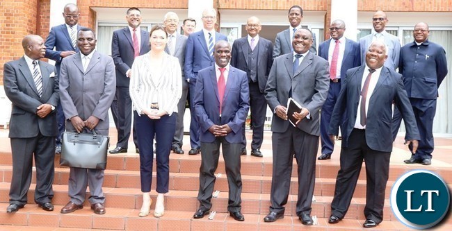 President Edgar Lungu (behind) poses for the picture with vedanta resources team after having a meeting at state house today . Picture by SUNDAY BWALYA /. ZANIS