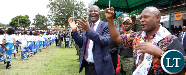 President Edgar Lungu salutes at MMD Supporters during the international Womenis Day commemoration at the Show grounds in Lusaka