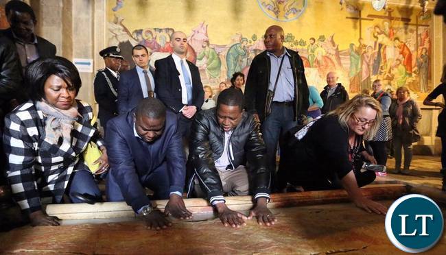 President Lungu with Commerce Minister Margaret Mwanakatwe and Foreign Affairs Minister Harry Kalaba at the Tomb where Jesus Christ was buried in Jerusalem President Lungu with Commerce Minister Margaret Mwanakatwe and Foreign Affairs Minister Harry Kalaba at the Tomb where Jesus Christ was buried in Jerusalem