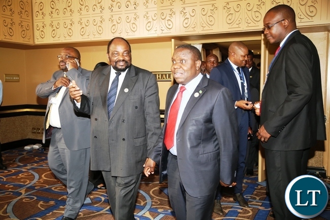 FOREIGN Affairs Minister, Harry Kalaba ( In red tie), with other dignitaries, come out of the Southern Africa Development Community (SADC) Council of Ministers held at Royal Swazi Hotel in Swaziland on Wednesday. PICTURE BY STEOPHEN MUKOBEKO/ZANIS