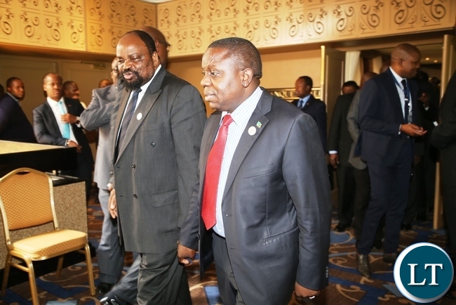 FOREIGN Affairs Minister, Harry Kalaba ( In red tie), with other dignitaries, come out of the Southern Africa Development Community (SADC) Council of Ministers held at Royal Swazi Hotel in Swaziland on Wednesday. PICTURE BY STEOPHEN MUKOBEKO/ZANIS