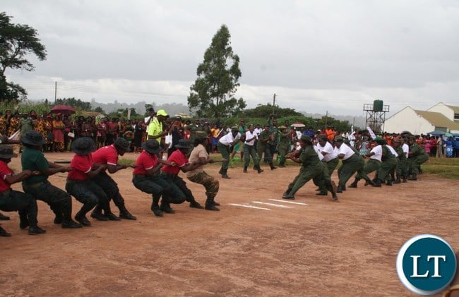 The combined team of Zambia Army and Zambia National Service Women (l) beat their combined counterparts from Zambia Police and Zambia Correctional services in the tug of way at Youth Alive grounds during the commemoration of International Women Day at Youth Grounds in Solwezi on Wednesday. PICTURE BY BETRAM KAOMA /ZANIS