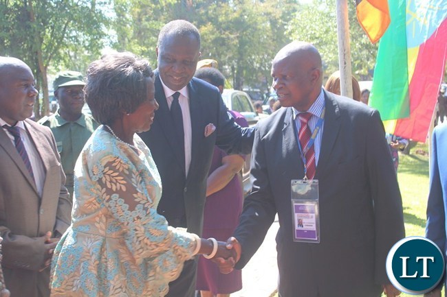 VICE President Inonge Wina (l) shakes hands with Zimbabwean Finance and Economic Development Patrick Chinamasa while Finance Minister Felix Mutati (c) looks on. This was shortly before the official opening of the Batoka Gorge Hydroelectric Power, Investors Conference at David Livingstone Safari Lodge in Livingstone VICE President Inonge Wina (l) shakes hands with Zimbabwean Finance and Economic Development Patrick Chinamasa while Finance Minister Felix Mutati (c) looks on. This was shortly before the official opening of the Batoka Gorge Hydroelectric Power, Investors Conference at David Livingstone Safari Lodge in Livingstone