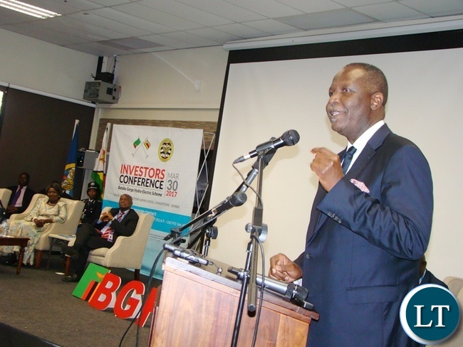 FINANCE Minister Felix Mutati gives his speech during the official opening of the Batoka Gorge Hydroelectric Power, Investors Conference at David Livingstone Safari Lodge in Livingstone yesterday. Far left sited are Vice President Inonge Wina (l) and Zimbabwean Finance and Economic Development Patrick Chinamasa. FINANCE Minister Felix Mutati gives his speech during the official opening of the Batoka Gorge Hydroelectric Power, Investors Conference at David Livingstone Safari Lodge in Livingstone yesterday. Far left sited are Vice President Inonge Wina (l) and Zimbabwean Finance and Economic Development Patrick Chinamasa.