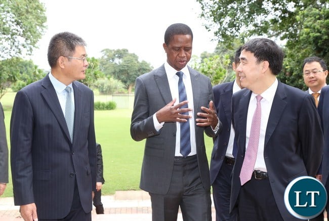 ,President Edgar Lungu confers with Chairman of the Board of Directors Bank of China Guoli Tian (r) while Chinese Ambassador Yang Youming listerns when the delegation called on the President at State House