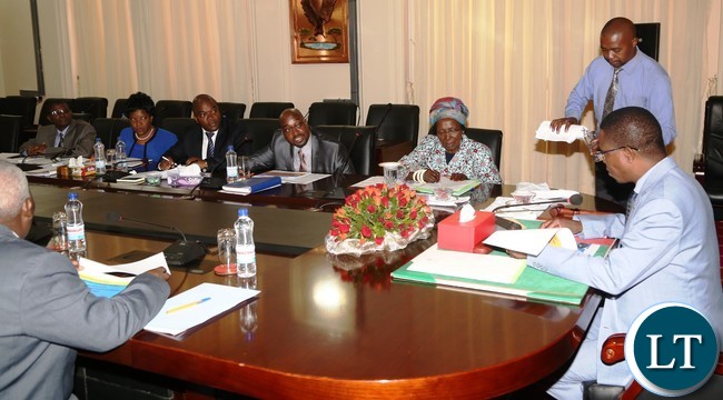 President Edgar Lungu flanked by Vice President Inonge Wina speaks to Minister of Transport and communication Brain Mushimba and his technocrats during the presentation of the quarterly report 2016 at State House