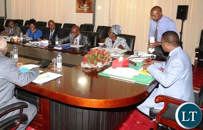President Edgar Lungu flanked by Vice President Inonge Wina having a light moment with Minister of Transport and communication Brain Mushimba and his technocrats during the presentation of the quarterly report 2016 at State House