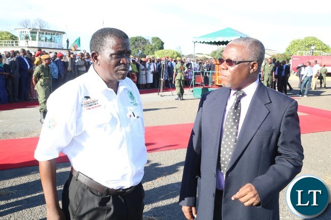 Western Province Minister Nathaniel Mubukwanu and his Permanent Secretary Mwangala Liomba await the arrival of the President at Mongu airport