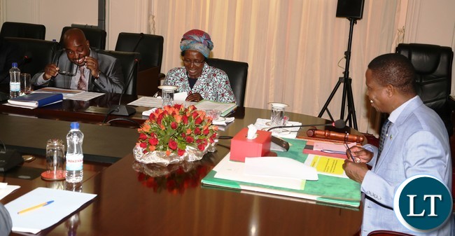 President Edgar Lungu (r) Vice President Inonge Wina (c) Minister of Transport and communication Brain Mushimba having a light moment during the presentation of the quarterly report 2016 at State House